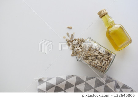 Top View of Sunflower Seeds in Jar and Bottle of Vegetable Oil Top View of Sunflower Seeds in Jar and Bottle of Vegetable Oil 122646806