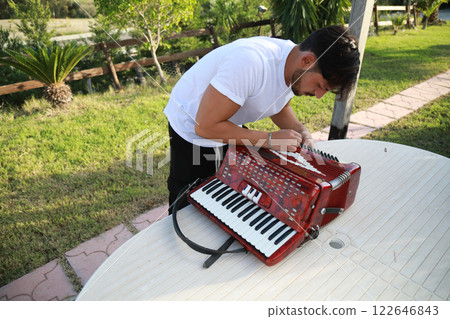 Tuning Of The Accordion Before Starting To Play Tuning Of The Accordion Before Starting To Play 122646843