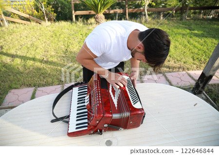 Professional Player Fixing And Tuning The Accordion Professional Player Fixing And Tuning The Accordion 122646844