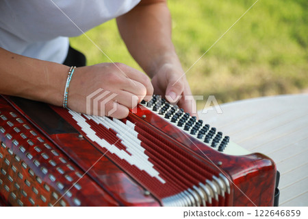 Player Preparing To Play Accordion Player Preparing To Play Accordion 122646859