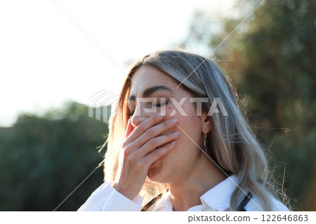 Overworked Doctor Catching Her Breath in Fresh Air 122646863