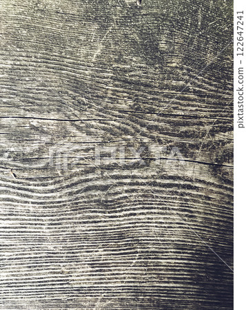 The image is a close up of a wooden surface with a grainy texture 122647241