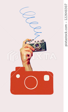 Conceptual art design. Hand holding vintage camera with abstract red camera shape symbolizing digital photography and content creation. 122648307
