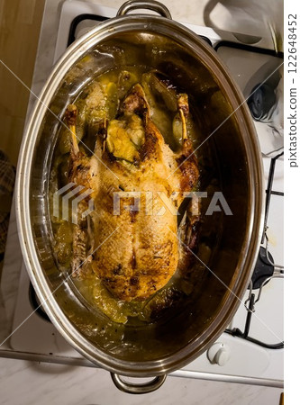 Traditional roasted stuffed Christmas Peking duck with herbs and vegetables. Chinese cuisine. Product concept 122648452