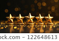 Five golden stars on stands with glittering bokeh lights in the background signifying excellent rating. Concept of excellence. 122648613