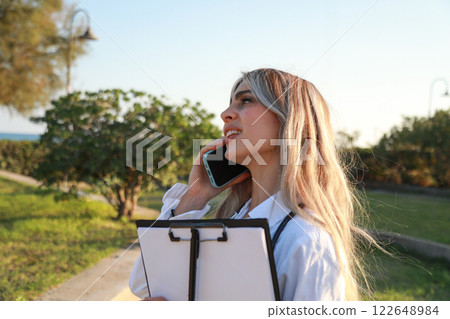 Doctor Making a Vital Call in Outdoor Setting Doctor Making a Vital Call in Outdoor Setting 122648984
