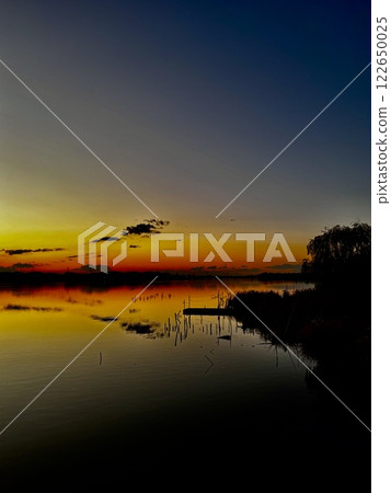 Sunset on the surface of the water Sunset on the surface of the water 122650025