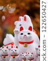 Gotokuji beckoning cat and autumn leaves 122650427