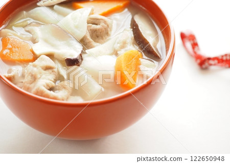 Miso-based pork soup in a red lacquerware bowl 122650948