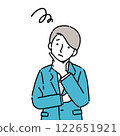 A young man in a suit with his arms folded and worried 122651921