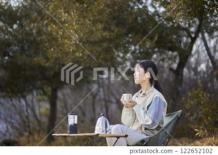 Japanese woman enjoying the outdoors in the winter mountains 122652102