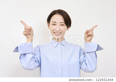 Woman pointing left and right on white background Woman pointing left and right on white background 122652264