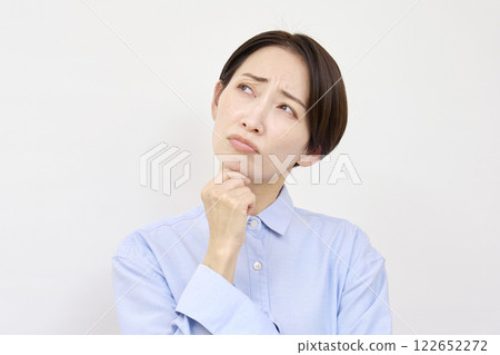 Worried woman white background Worried woman white background 122652272