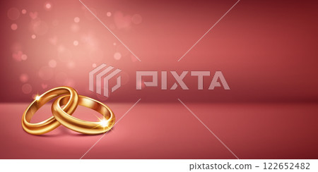 Two intertwined gold wedding rings and small hearts on pink. 122652482
