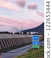 Road sign in the austrian alps with mountains in the background3 122653444