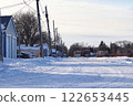 Snowy winter backyard in the city 122653445