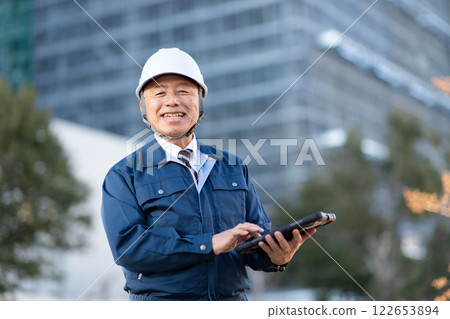 Veteran construction manager and architect Veteran construction manager and architect 122653894