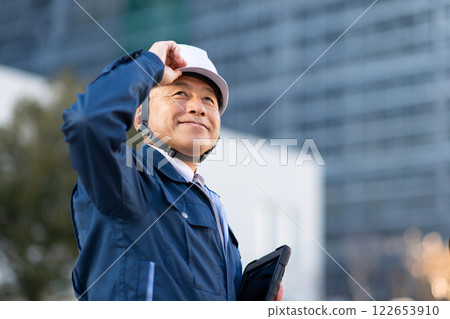 Veteran construction manager and architect Veteran construction manager and architect 122653910