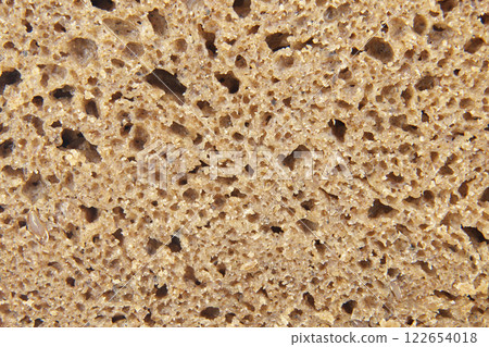 A Detailed Close-up of the Airy, Dense Crumb of a Rustic Dark Bread Loaf A Detailed Close-up of the Airy, Dense Crumb of a Rustic Dark Bread Loaf 122654018