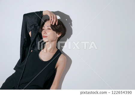 Cool female model in black outfit 122654390