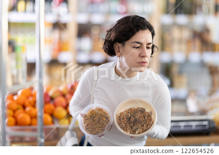 Adult woman choosing yakisoba in grocery store 122654526