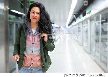Woman traveler waiting train at subway station 122654820
