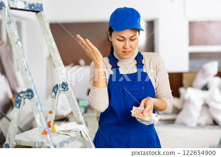 Female builder is unhappy with the money received for work done Female builder is unhappy with the money received for work done 122654900