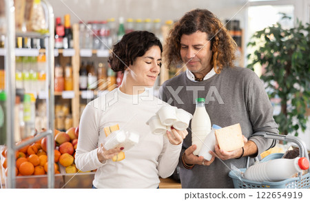 Husband and wife choose dairy products 122654919