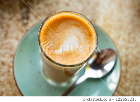 Image of cup of fresh coffee cortado on table 122655233