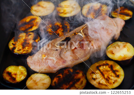 Pork shoulder roasted with eggplants in fry pan 122655253