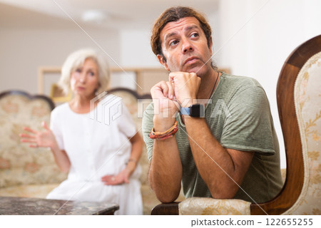 Mature couple quarreling at home, relationship problems Mature couple quarreling at home, relationship problems 122655255