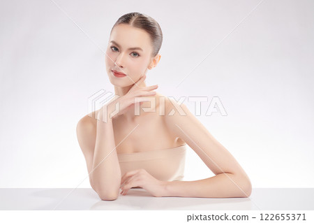 Beautiful young woman with clean fresh skin on white background, Face care, Facial treatment, Cosmetology, beauty and spa, women portrait. Beautiful young woman with clean fresh skin on white background, Face care, Facial treatment, Cosmetology, beauty and spa, women portrait. 122655371