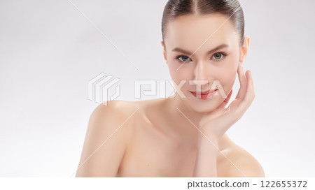 Beautiful young woman with clean fresh skin on white background, Face care, Facial treatment, Cosmetology, beauty and spa, women portrait. Beautiful young woman with clean fresh skin on white background, Face care, Facial treatment, Cosmetology, beauty and spa, women portrait. 122655372
