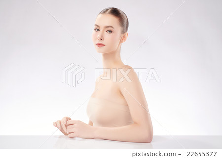 Beautiful young woman with clean fresh skin on white background, Face care, Facial treatment, Cosmetology, beauty and spa, women portrait. Beautiful young woman with clean fresh skin on white background, Face care, Facial treatment, Cosmetology, beauty and spa, women portrait. 122655377