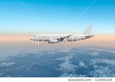 White passenger airliner fly in the air above the clouds 122656108