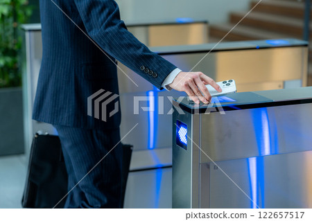 Office worker passing through security gate 122657517