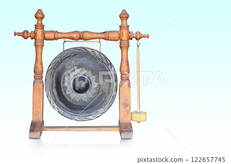 front view Antique Burmese Bronze Temple Gong with Mallet Mounted on Turned Wooden Stand on gradient blue and white background, object, buddha, thai, object, copy space 122657745