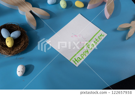 Painting Easter bunny rabbit with eggs Gift Easter idea. Do it yourself instruction postcard eco-friendly decoration. Making handmade art presents children's diy projects. Spring holiday family time Painting Easter bunny rabbit with eggs Gift Easter idea. Do it yourself instruction postcard eco-friendly decoration. Making handmade art presents children's diy projects. Spring holiday family time 122657938