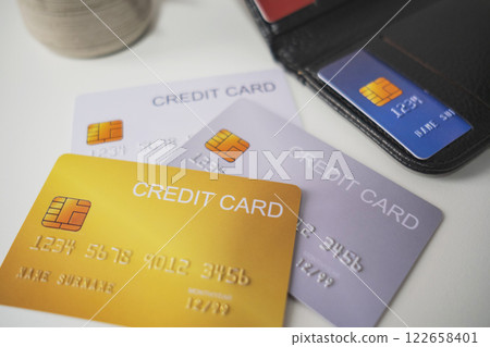 Pile of credit cards on white background. Cashless technology and credit card payment concept. Pile of credit cards on white background. Cashless technology and credit card payment concept. 122658401