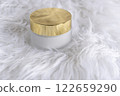 a white glass jar for moisturizing cream with a gold lid on white background. Mockup for branding product packaging. High quality photo 122659290