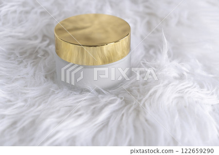 a white glass jar for moisturizing cream with a gold lid on white background. Mockup for branding product packaging. High quality photo 122659290