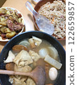 A table filled with oden, German potatoes, fried rice, and other dishes from various countries 122659857