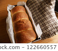 Freshly baked homemade bread and mittens 122660557