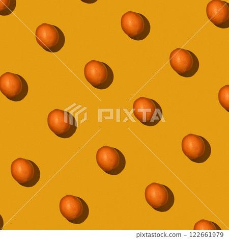 Fresh juicy whole orange on yellow background. Fruit pattern, summer concept. Flat lay Top view. Background with citrus fruits 122661979