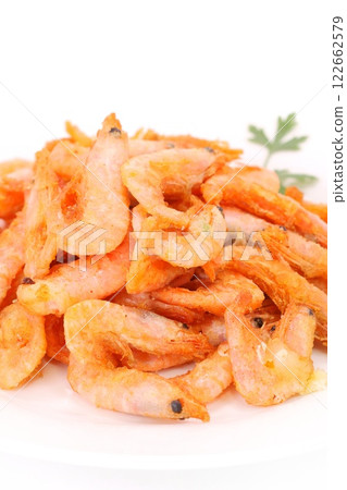 Deep fried shrimp snack with shell on light background Deep fried shrimp snack with shell on light background 122662579