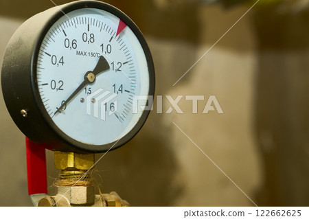 Hot water temperature sensor in a basement plumbing system Hot water temperature sensor in a basement plumbing system 122662625