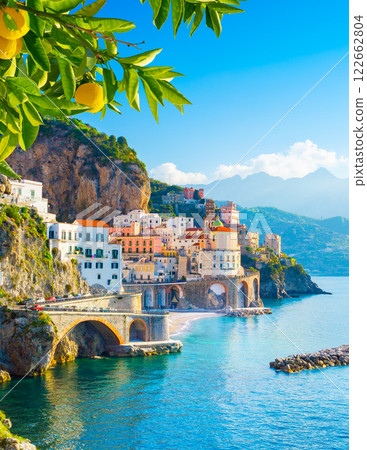 Beautiful view of Amalfi on the Mediterranean coast with lemons in the foreground, Italy 122662804