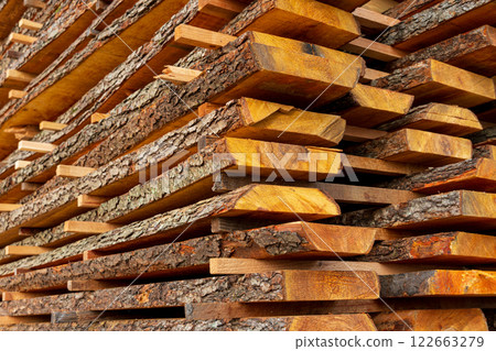 A boards in an industrial sawmill. Wood timber construction material A boards in an industrial sawmill. Wood timber construction material 122663279