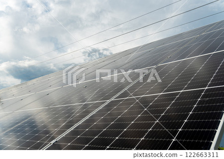 Close-up view on photovoltaic solar panels. Production of renewable energy concept. 122663311