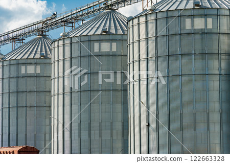 Agricultural silos for storage harvest. Granary elevator. Agribusiness Agricultural silos for storage harvest. Granary elevator. Agribusiness 122663328